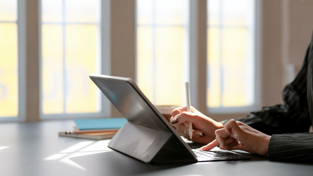 person-using-tablet-computer-with-keyboard-3815615